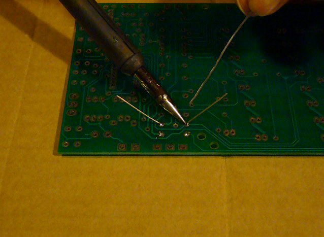 Applying heat to solder joint, heating PC board and component lead