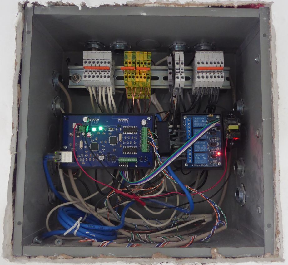 Bathroom electrical box with automation hardware on DIN rails: 1284 board, power supply, relay modules