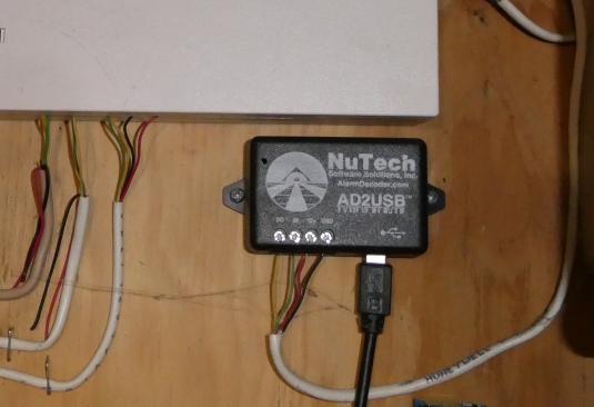 Image of AlarmDecoder AD2USB mounted to panel