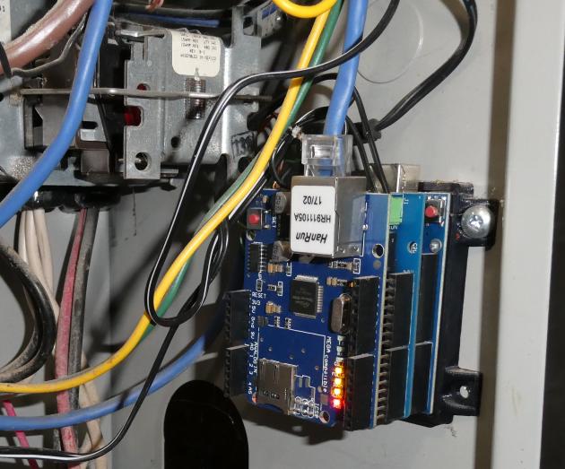 Image of Arduino Uno, W5100 Ethernet shield, 4 relay shield based HVAC controller mounted in furnace with 3D printed base