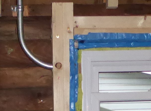 Image of conduit running to rough opening of bathroom window, left side 90 degree to point up