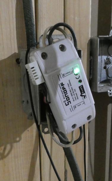 Image of Sonoff basic used as temporary switch hanging off electrical box in kitchen with DHT22 sensor added