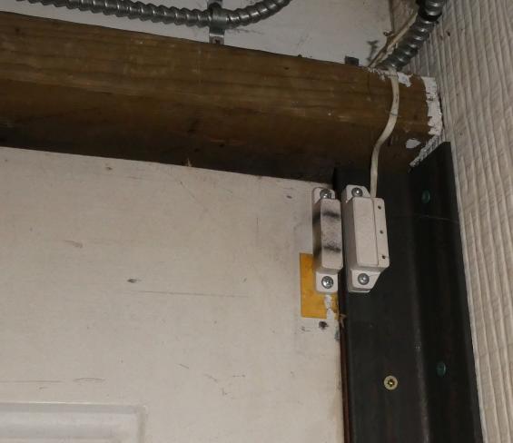 Image of shop door magnetic contact alarm sensor on door