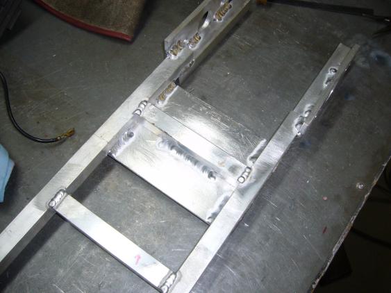 Motor mounting plate welded to frame