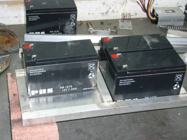Batteries being test fitted in battery trays