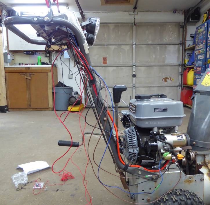 Image of wiring up the electrical system, key switch, battery, starter, lights